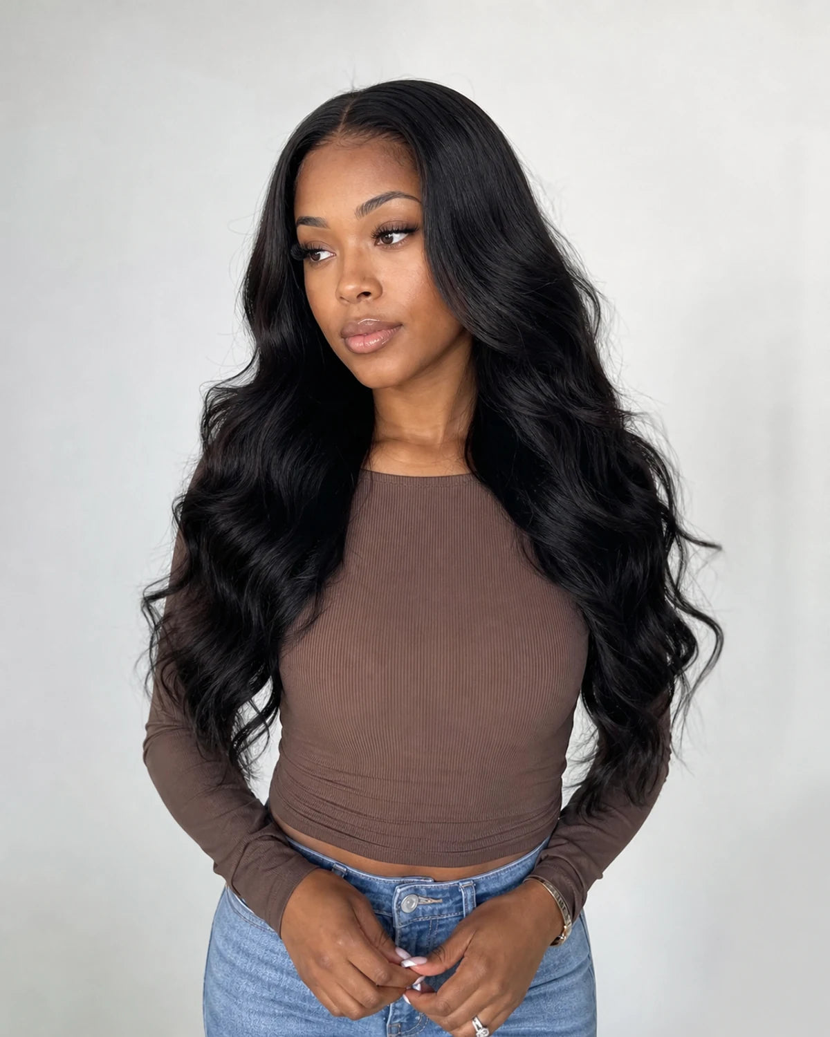 Natural Black Body Wave human hair wig worn by a model in a premium salon setting
