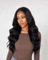 Natural Black Body Wave human hair wig worn by a model on a clean ecommerce background
