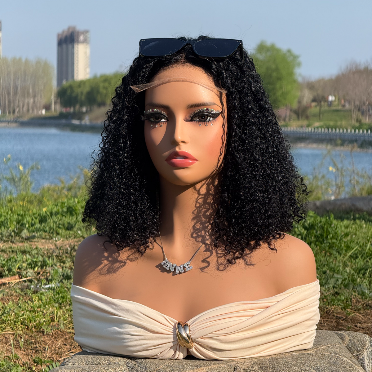 Curly bob on a mannequin outdoors, showing the overall curl silhouette.